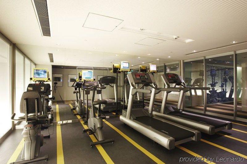 Ambassador Hotel Καοσιούνγκ Εξωτερικό φωτογραφία The photo shows an indoor gym space equipped with exercise machines. There are several treadmills lined up, each with a screen attached for monitoring workouts. The gym has a sleek and modern design, with a clean floor and large windows allowing natu